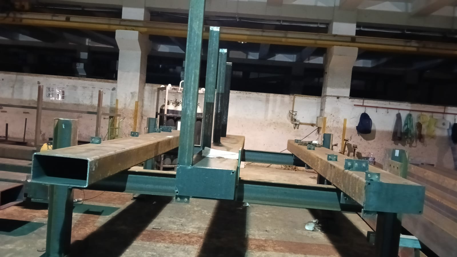 Heavy hollow section steel beams on workshop fabrication jigs
